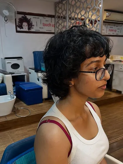 This cut works with the hair's natural wave to create an effortlessly cool style.