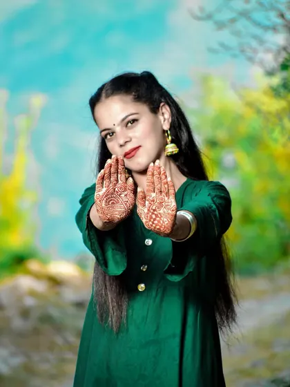 A beautiful shot of the bride-to-be presenting her mehndi, with a soft, artistic background.