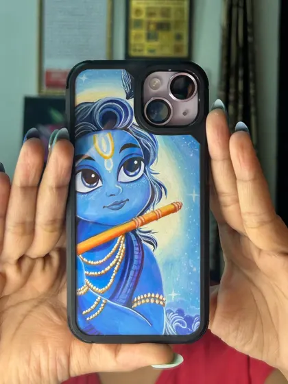 Here is the Krishna phone cover held up to show how it looks in real life. Each piece is carefully painted and sealed before being placed in a protective case.