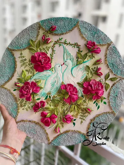 The full 16-inch circular panel featuring the kissing doves, showcasing the intricate border and lush floral arrangement.