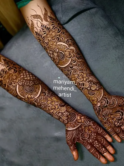 A full-arm bridal design featuring hibiscus flowers and other delicate floral elements.