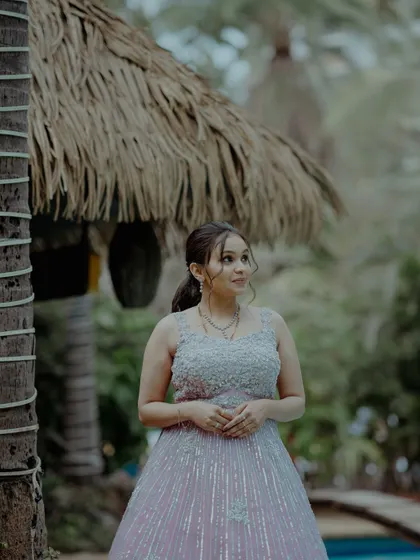 A princess in a beautiful pink gown. The makeup is soft and dreamy, with a simple hairstyle that lets the outfit shine.