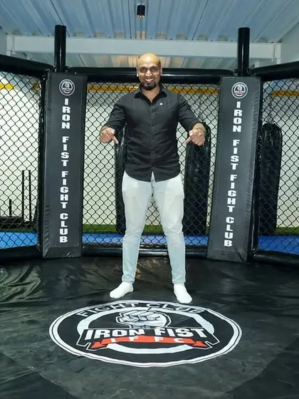 Event announcer King James hyping up the crowd from the center of our octagon. We create events that are as exciting for the audience as they are for the fighters.
