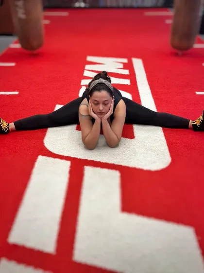 A moment of reflection during a cool-down stretch. Discipline in fitness mirrors the discipline needed for vocal training.