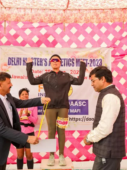 One of our runners on the top of the podium, celebrating her gold medal at the Delhi Master's Athletics Meet. A moment of pure joy and accomplishment.