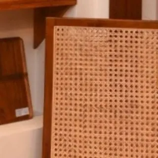 A detail shot of the classic cane webbing used in my furniture. This traditional technique, like the weaving in my lamps, has a timeless appeal that I love to incorporate into my work.
