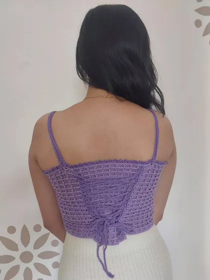 The back of the Aurelia Top features a corset-style lacing for an adjustable and perfectly snug fit.