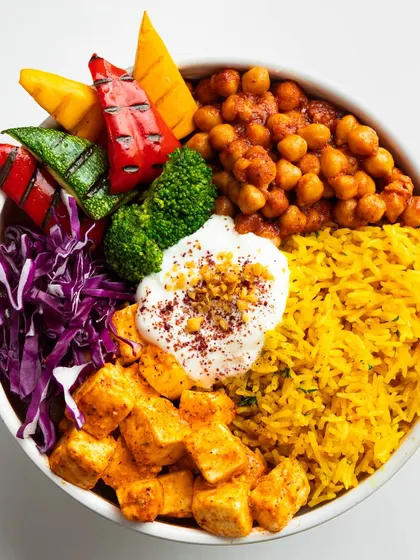 The summer champion. Our humble Shish Tawook Bowl is light yet satisfying, with tender grilled meat, vibrant turmeric rice, and crisp vegetables.