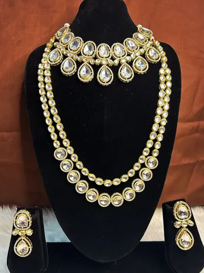For a more modern and elegant look, we offer this white stone Kundan set for rent. It includes a simple choker and a matching two-layer necklace that can be worn together or separately.