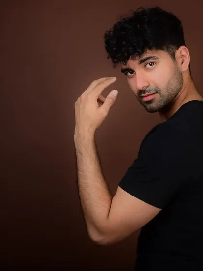 A subtle and engaging look towards the camera. This kind of shot is powerful for an actor's headshot, drawing the viewer in with a simple gesture.