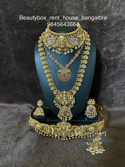 A unique temple jewellery set with a layered look, combining a choker and two distinct haarams.