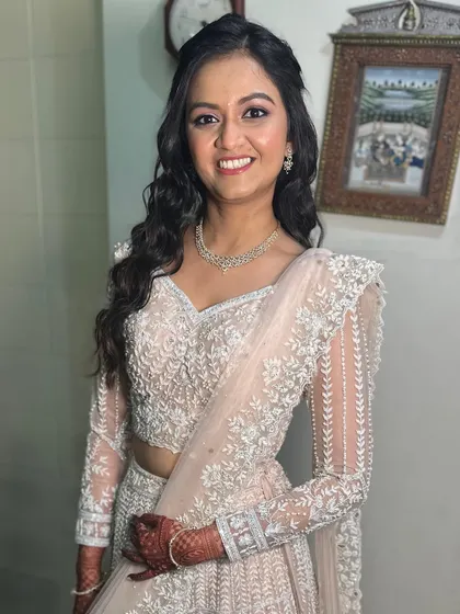 Barely-there blush and endless allure. This dreamy look in a soft peach lehenga is perfect for an engagement party.