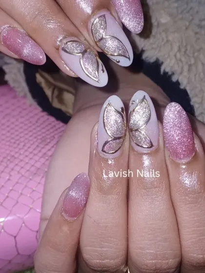 A close-up of the shimmering butterfly wing design, showing the combination of glitter and fine line work on a cat-eye effect base.
