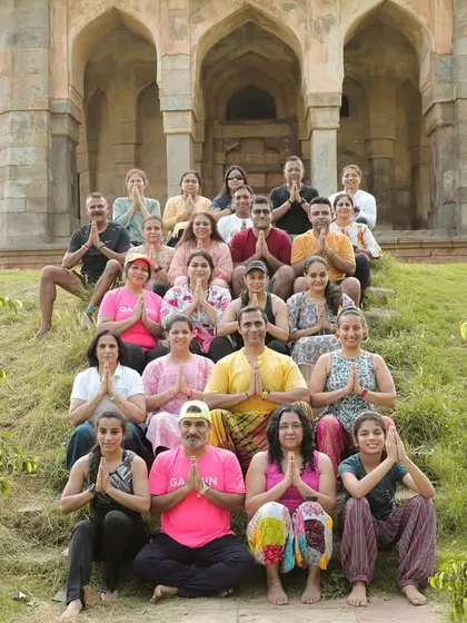Our group practicing yoga together in front of a historic monument. We incorporate yoga and stretching for flexibility, recovery, and mindfulness.