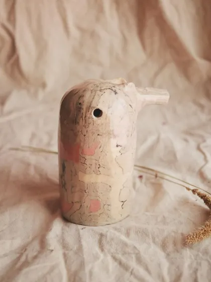 This singing pajarito is made with the Nerikomi technique, giving it a beautiful, marbled plumage with soft pink patches. The shape of each whistle changes its sound.