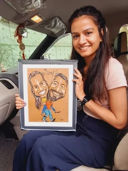 A happy client with her commissioned couple caricature, a perfect personalized gift for a special occasion.