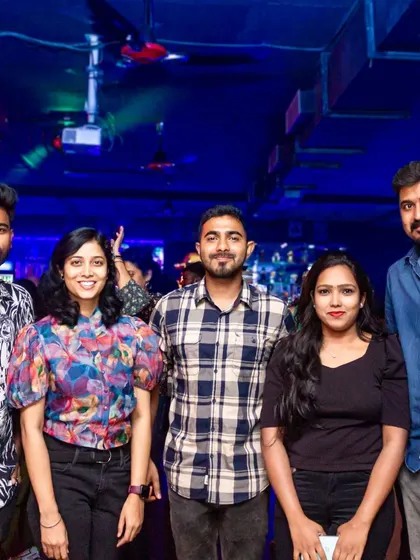 The whole crew assembled for a group photo, capturing the fun of a night out together.