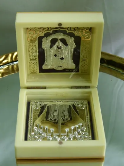This beautiful silver souvenir features the sacred feet of Tirupati Balaji in a presentation box. It's a deeply meaningful gift for any devotee.