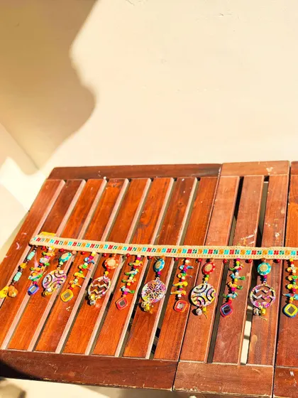 The full 'Rang-Tarang' toran basking in the sunlight. It’s a piece designed to bring a wave of color and happiness to your home.