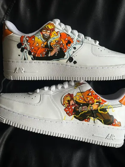 The full pair of Zenitsu-themed Demon Slayer custom sneakers, showcasing the action poses on both shoes.