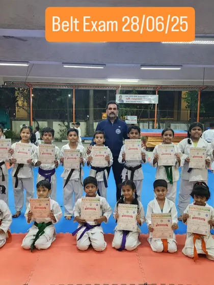 The next generation of martial artists. My youngest students proudly display their certificates after a successful belt exam, marking an important step in their karate journey.