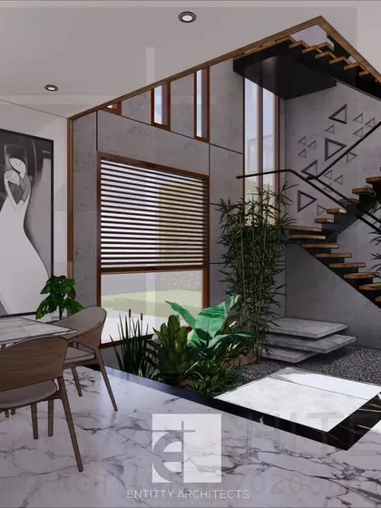 An interior perspective of the Lonavala bungalow, focusing on the central courtyard. This space brings natural elements like stone and plants indoors, creating a tranquil core around which the living areas are organized.