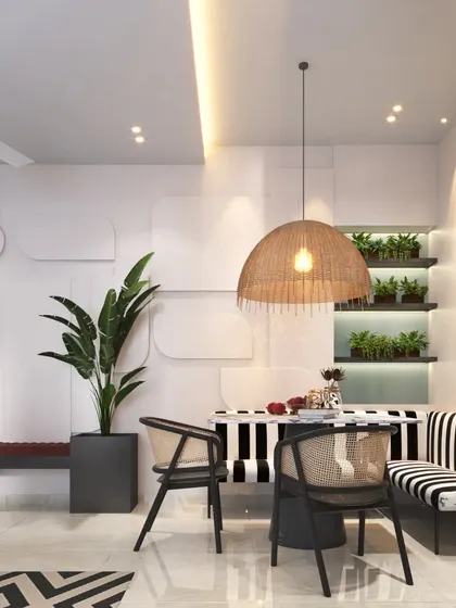 A dining area that beautifully incorporates biophilic design, with built-in shelves for plants and a large rattan pendant light.