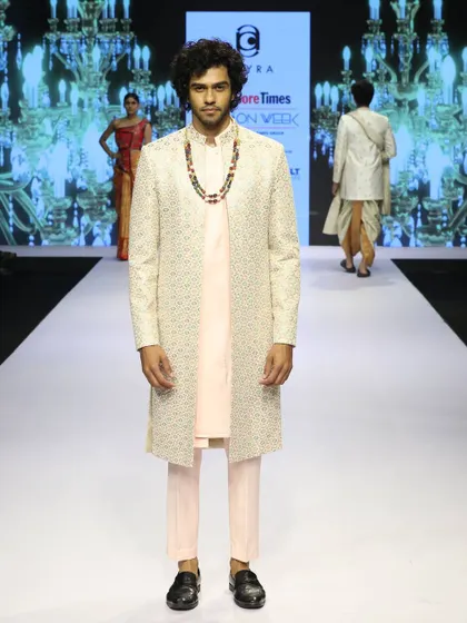 A full-length view of the pink kurta set with the embroidered overcoat, as seen on the Bangalore Times Fashion Week runway.
