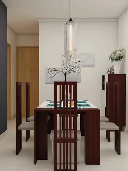 A classic dining room with a dark wood table and chairs. The grey accent wall and simple decor create a calm and sophisticated atmosphere.