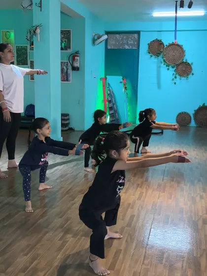Teaching a group of beginners the correct squatting posture. Building a strong foundation is my top priority.