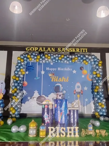 An outer space adventure theme with an astronaut, rockets, and a planet-filled backdrop.