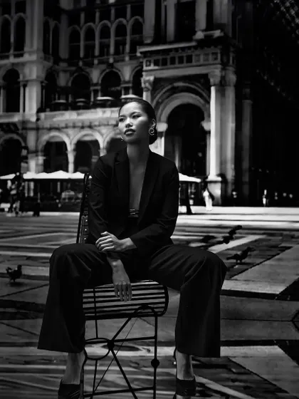 A black and white take on projection photography. The high-contrast European plaza backdrop adds a sense of drama and scale, a technique we cover for creating powerful editorial images.