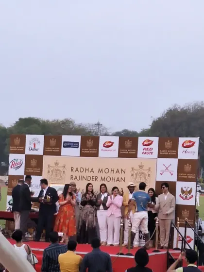On stage during the prize distribution ceremony for the Radha Mohan Rajinder Mohan polo cup. I ensure that the formalities and award presentations are conducted with grace and efficiency.