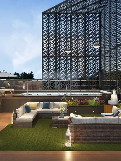 A luxurious rooftop terrace and pool designed for an executive floor in Gurgaon. This space combines leisure and entertainment with a vertical garden, comfortable lounge seating, and a semi-enclosed pool, demonstrating our ability to create exceptional lifestyle environments.