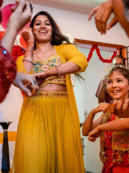 A bride dancing with a young family member. We create an atmosphere where all generations can interact and celebrate together on the dance floor.