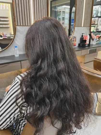 Before the Hair Botox treatment, this client's hair was wavy and prone to frizz.