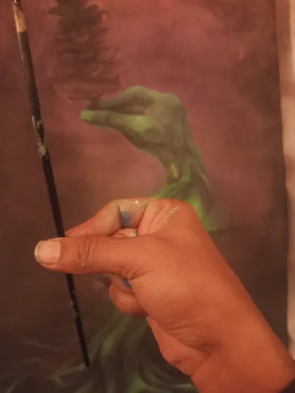 A close-up of my hand and brush while working on the nature canvas. It's a more meditative process than spraying a wall.
