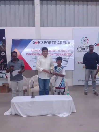 Our students from GMR Sports Arena receiving their awards at the annual Indoor Badminton Tournament.