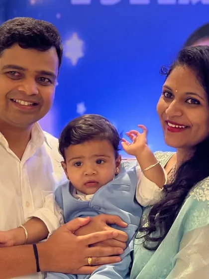 A happy family portrait taken against our 'Twinkle Twinkle Little Star' backdrop. Our goal is to create beautiful settings that result in cherished photo memories for our clients.