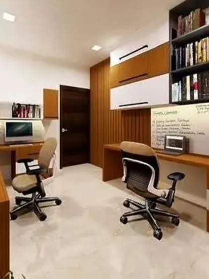 A practical home office designed for two people. The layout includes separate desk spaces with overhead storage and whiteboards for brainstorming.