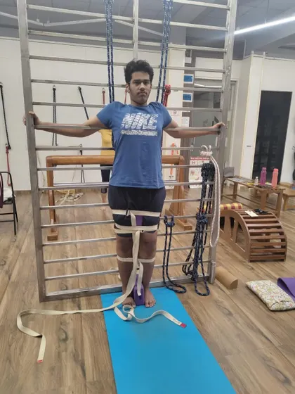 We focus on building a strong foundation, even for young students. Here, we use belts and a block to teach correct leg alignment.