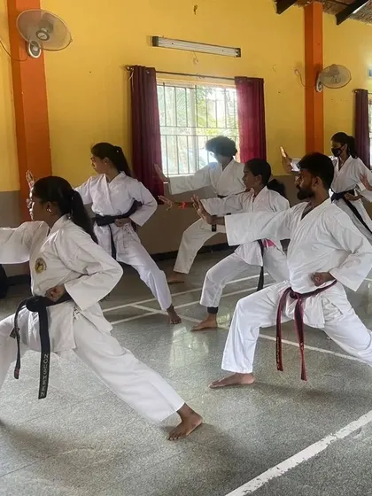 Precision in practice. Our female black belt students are seen here refining their stances and hand techniques during a senior Kata training session.