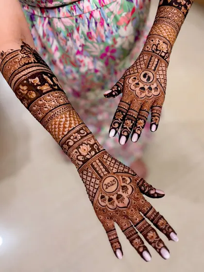 Another perspective of the personalized baby shower mehendi, highlighting the flow of the design across both arms.