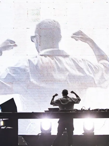 The power of a silhouette. DJ Snake's iconic pose is mirrored on the giant screen behind him, creating a larger-than-life moment during his packed arena show.