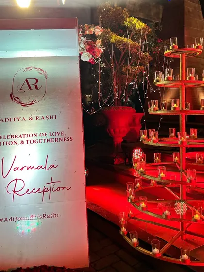 A personalized welcome sign for the Varmala and Reception, designed with the couple's monogram. This is one of the first things guests see, setting the tone for a personal and well-planned event.