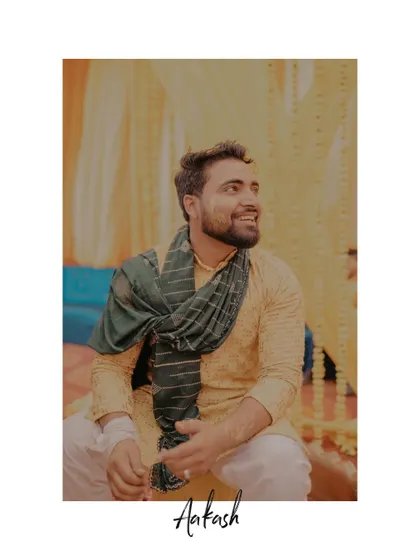 A candid portrait of the groom, smiling and relaxed during his Haldi ceremony.