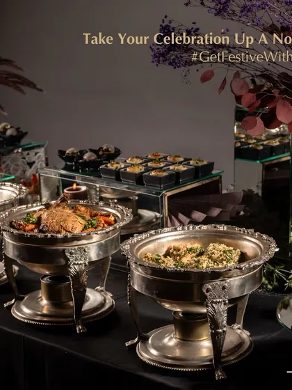 A beautiful buffet spread in silver chafing dishes for a Diwali celebration. We provide full-service catering to take your festive celebration up a notch.