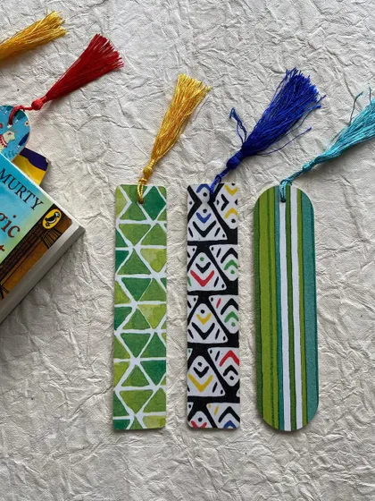 A set of bookmarks with green geometric and tribal patterns.