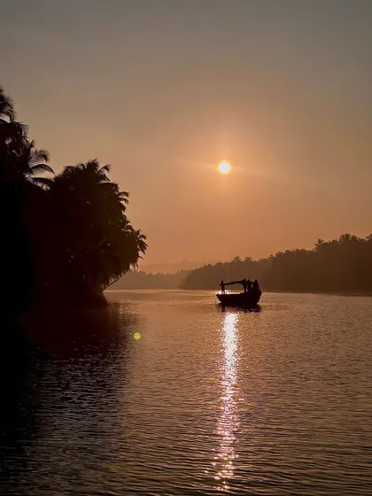 The sun reflecting on the water during a boat ride. A serene and beautiful moment.