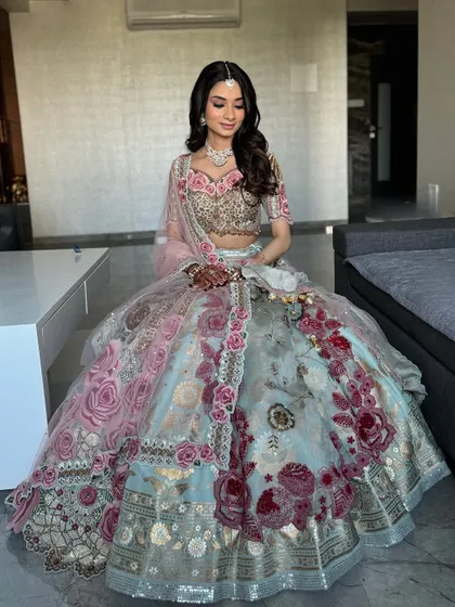 A full view of this breathtaking floral lehenga. The makeup is kept soft and radiant to maintain an overall look of grace and elegance.